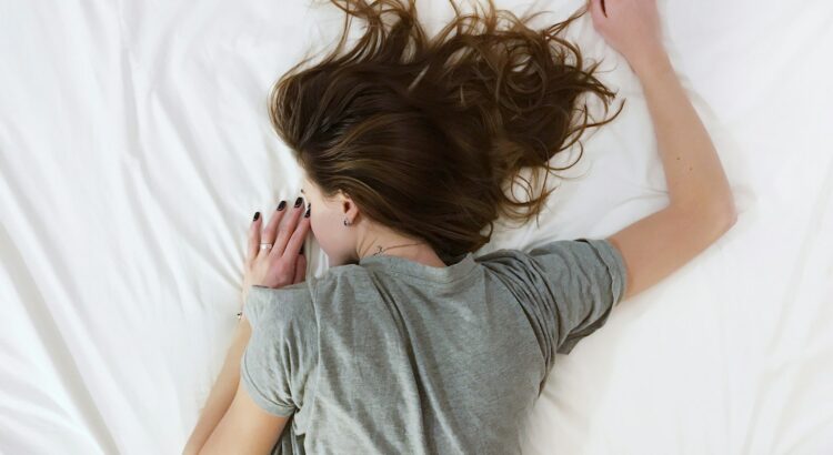 woman laying on bed