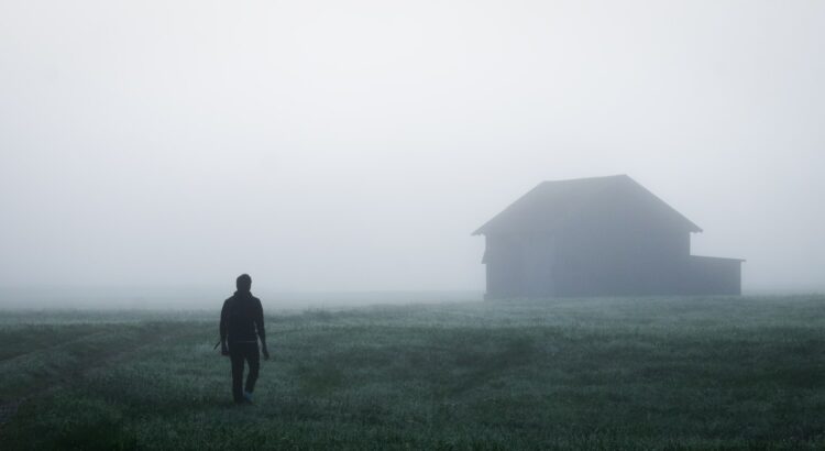 a man walking in a field