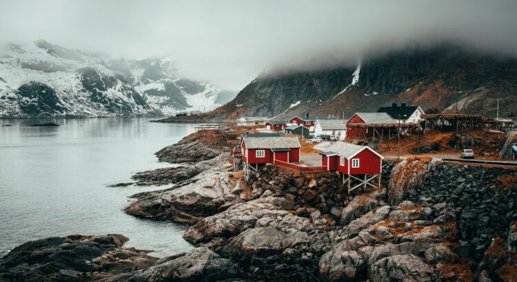 red and grey houses near river during daytime